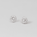 Silver Sunflower Stud Earrings, pair of silver flower studs with a small clear stone centre, on a pale grey background